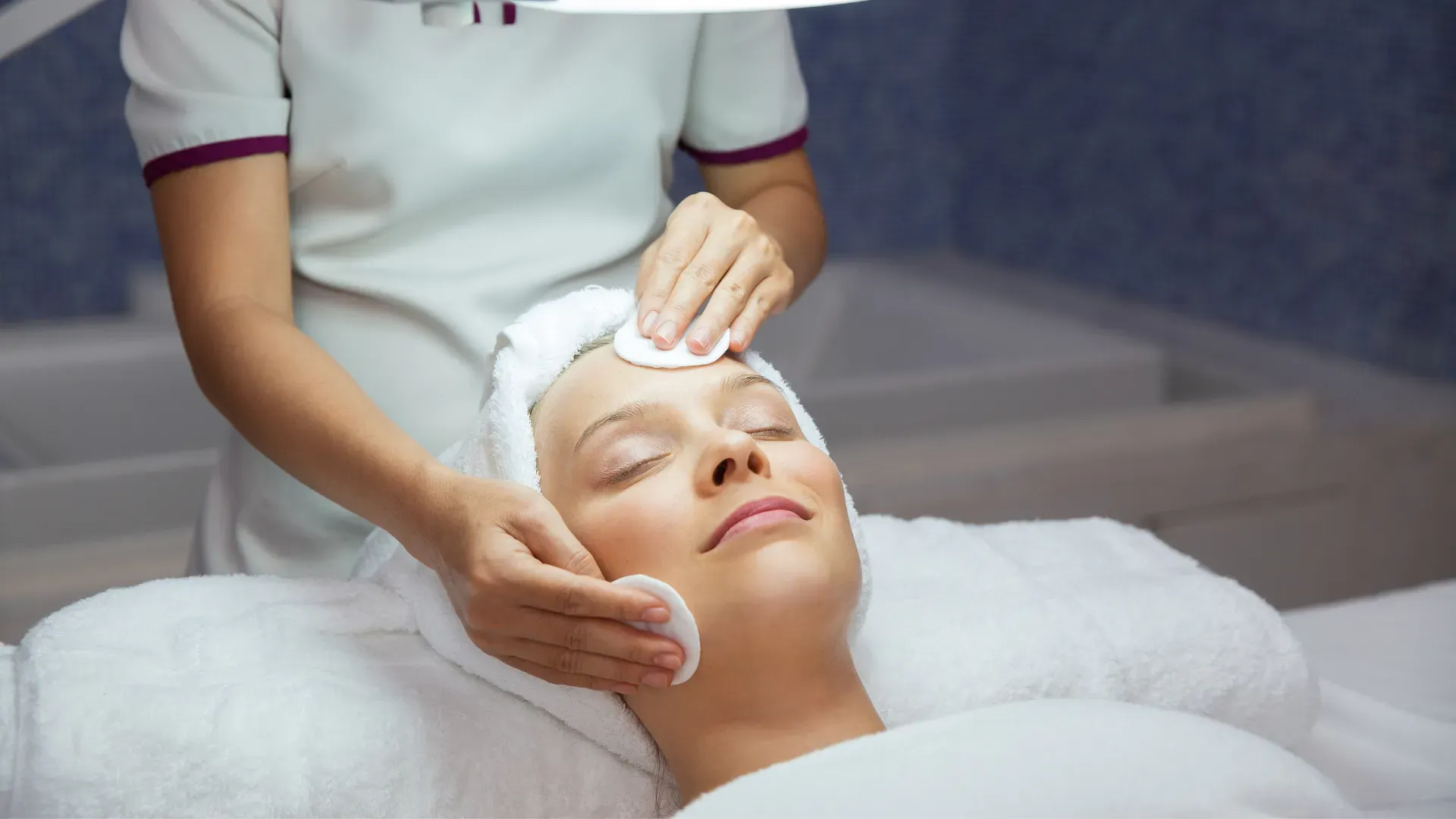 Client receiving a facial treatment at the spa