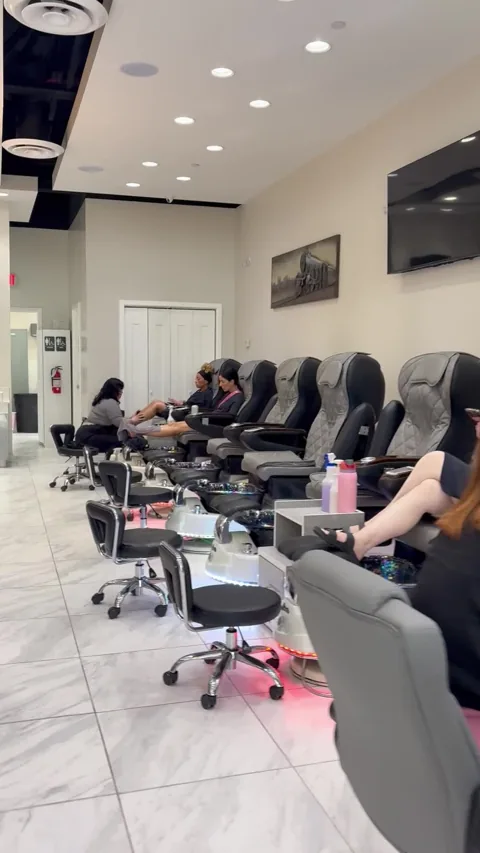 Manicure stations and pedicure chairs inside Apple Nailed It Spa in Gilbert